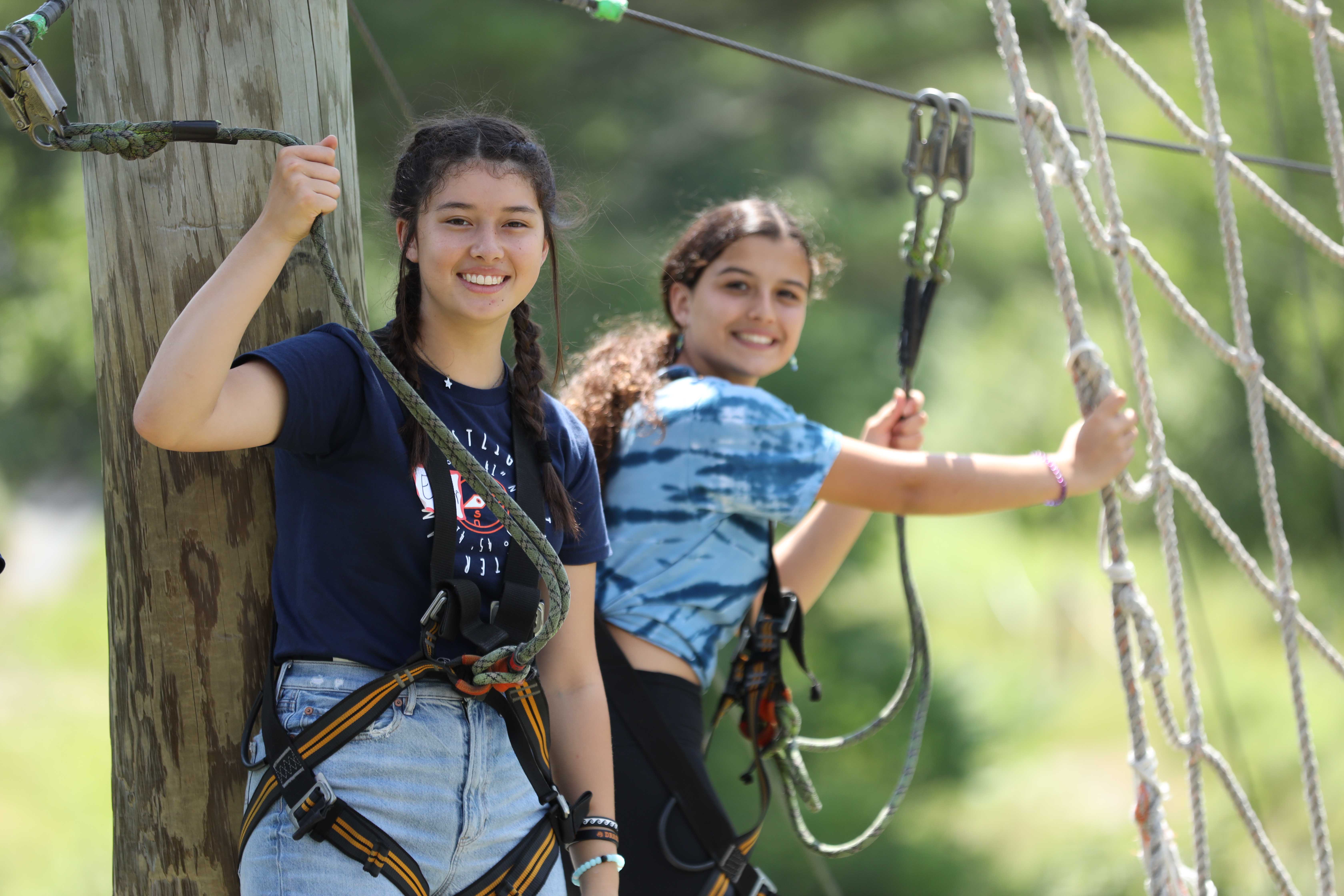 Campers on a high ropes course